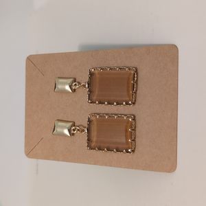 Gold Glass Drop Amber Square Earrings.
NOT FOR SALE